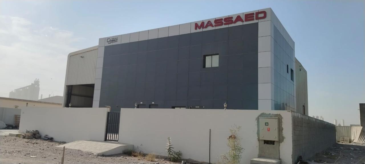 MASSAED factory building exterior in Ras Al Khaimah, UAE, with corporate signage