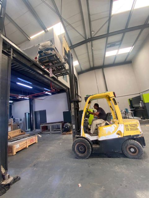 Forklift moving materials inside the factory