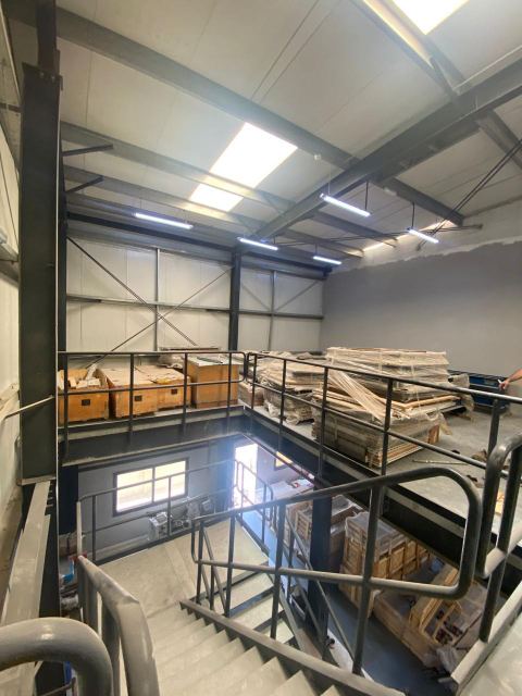 Mezzanine materials storage above the production hall