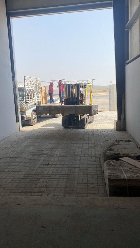 Delivery truck at the loading bay, seen from inside the factory