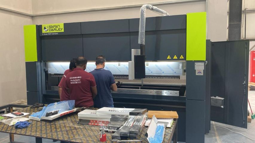 MASSAED technicians at the CNC press brake used to form stainless steel cabin and architrave panels