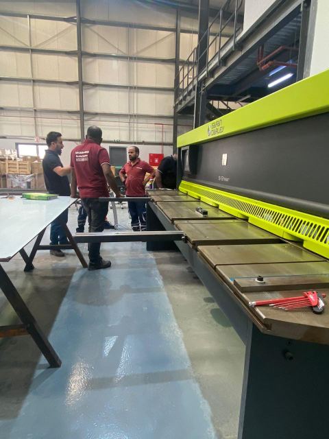 Team working along the sheet-metal fabrication line
